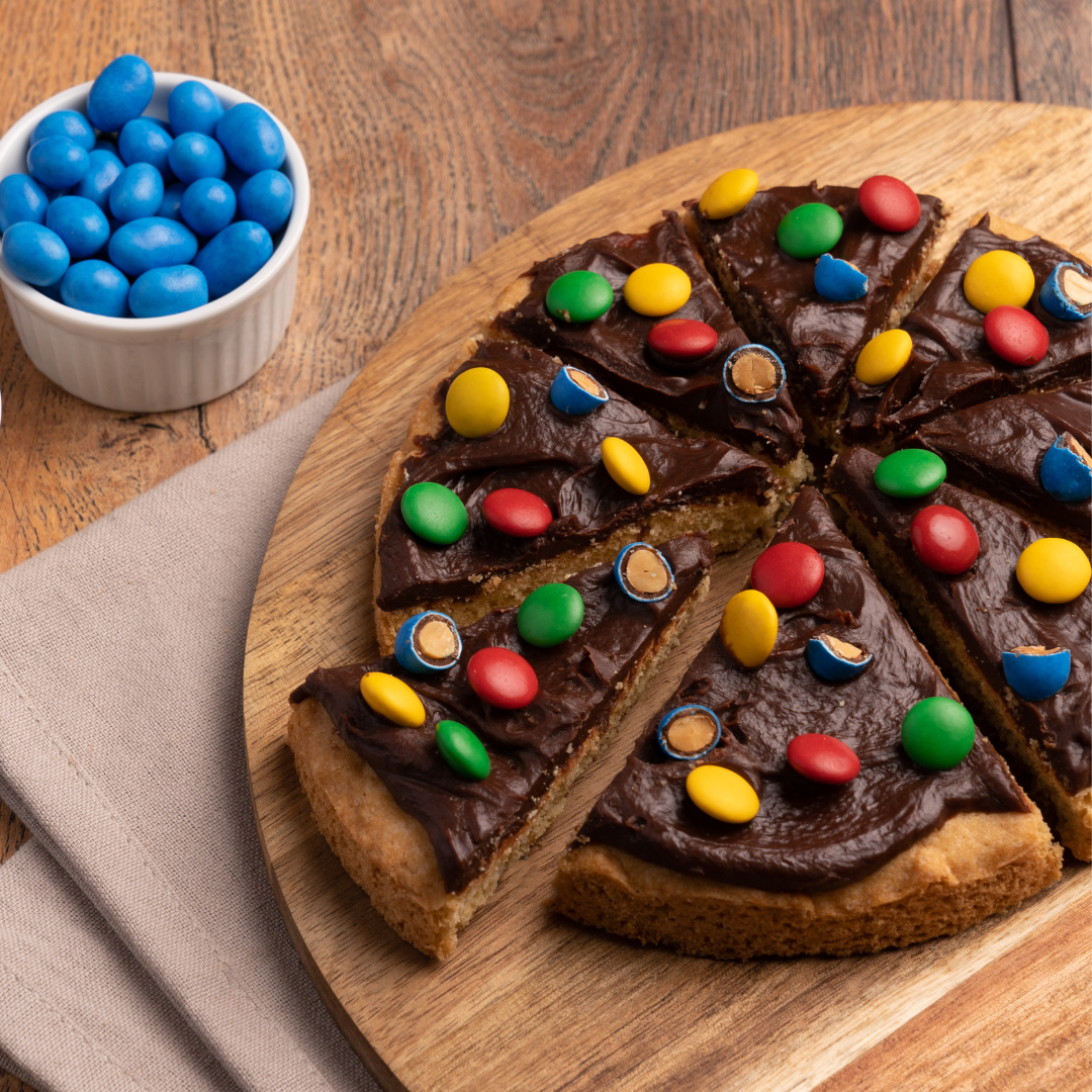 [:es]cordillera_chocolate_PizzaCookie-centro de mani con chocolate confitado + chocolate con leche multi color[:]